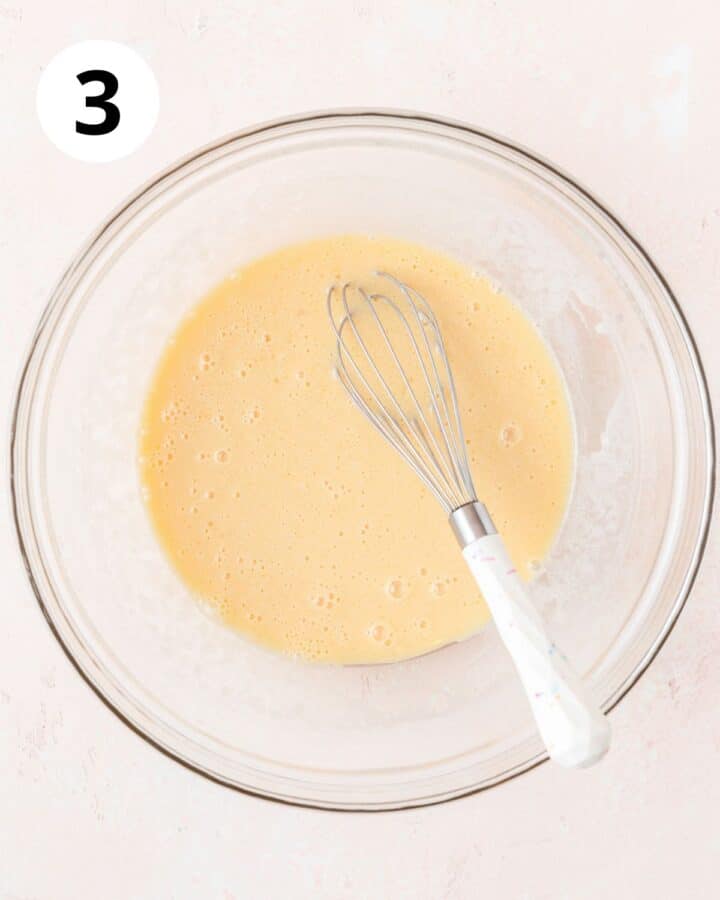 adding milk to cake batter. 