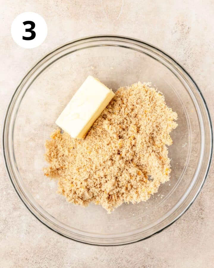 adding butter to sugar.