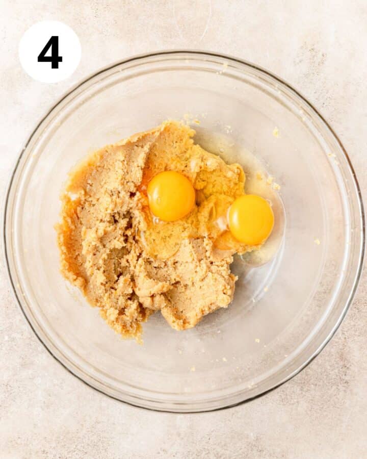 adding eggs to sugar.