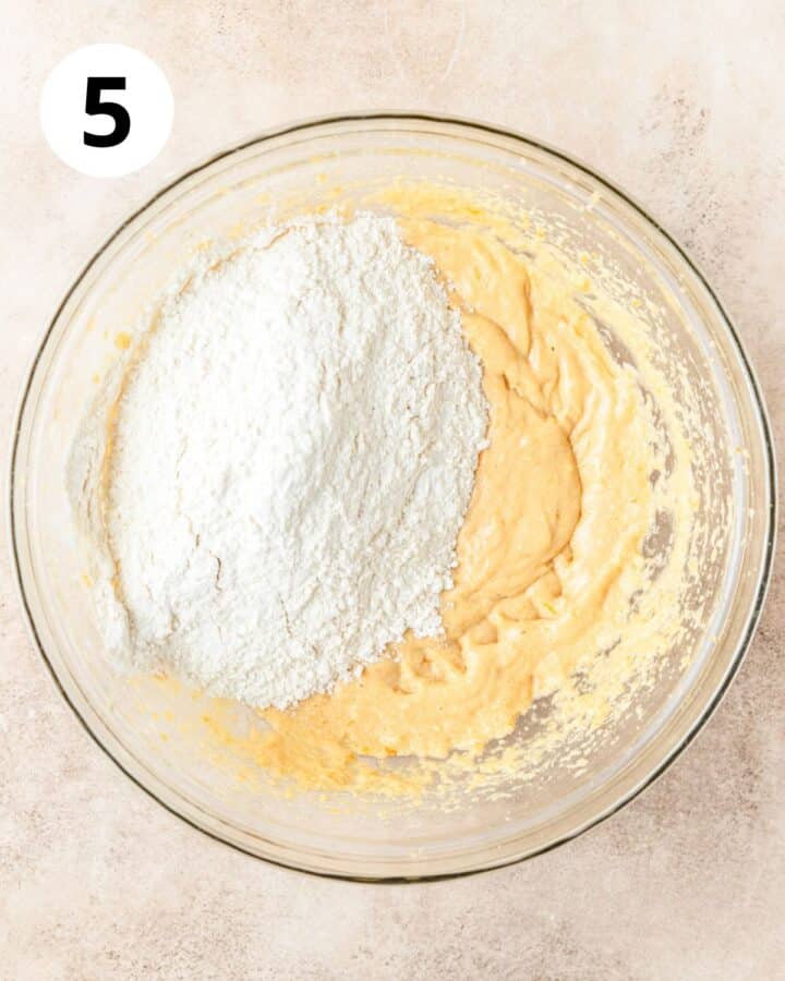 adding dry ingredients to biscotti dough. 