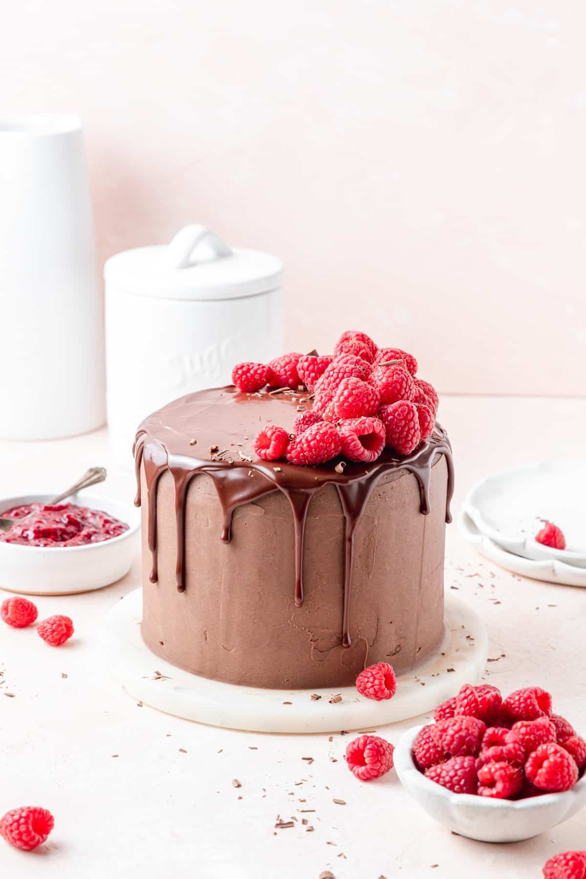 chocolate raspberry layer cake with dark chocolate drip. 