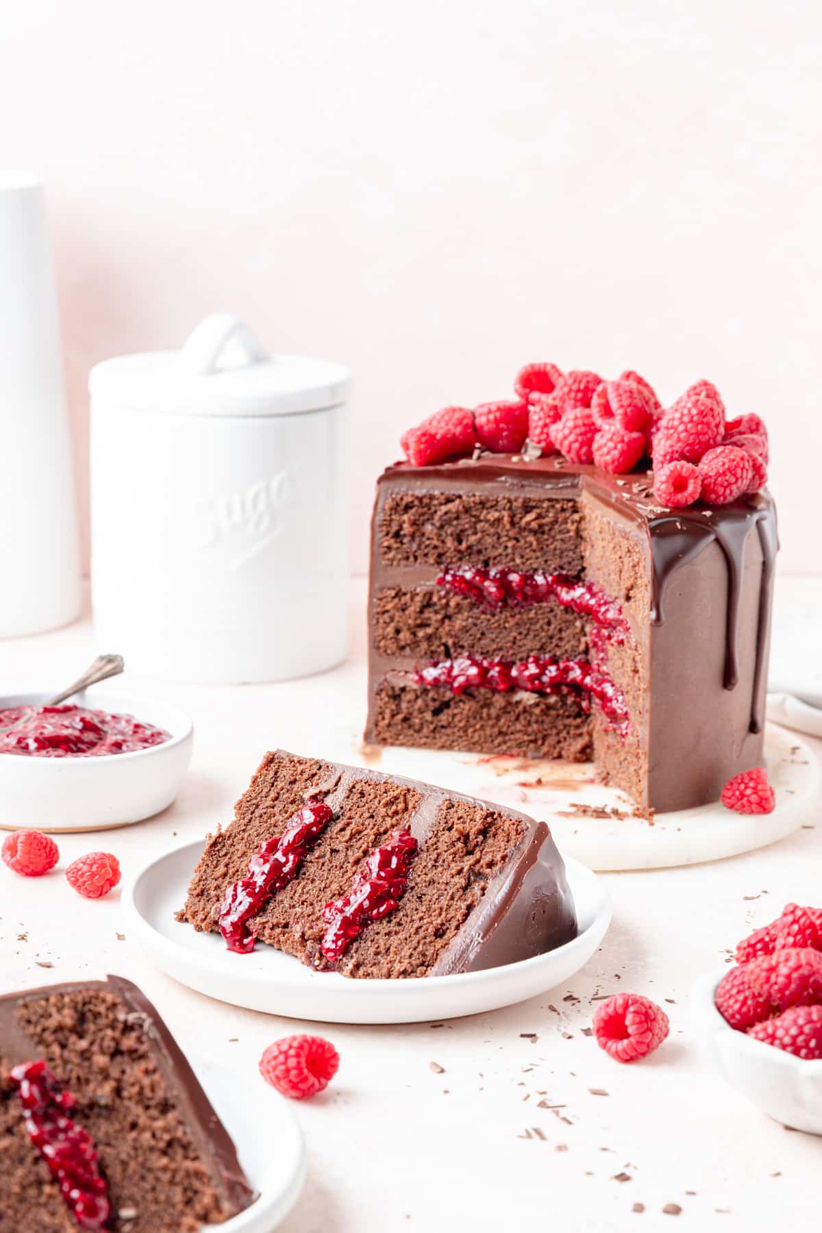slice of three layer chocolate raspberry cake.