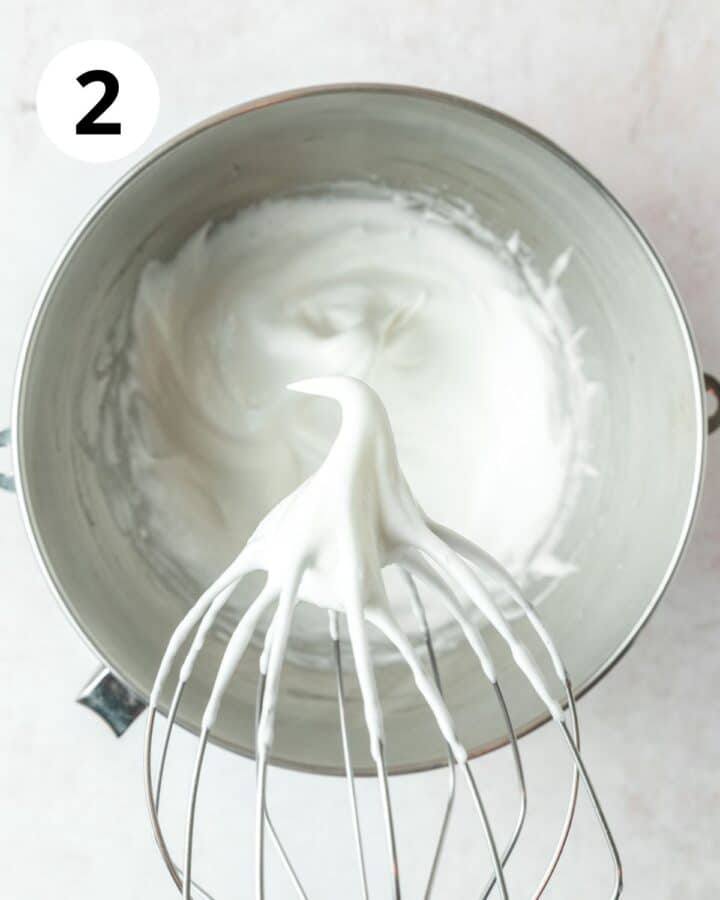 whipping egg whites to soft peaks.