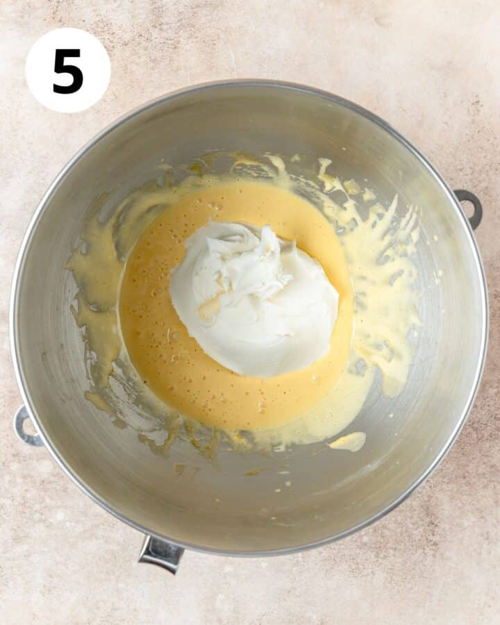 adding mascarpone to egg yolks.