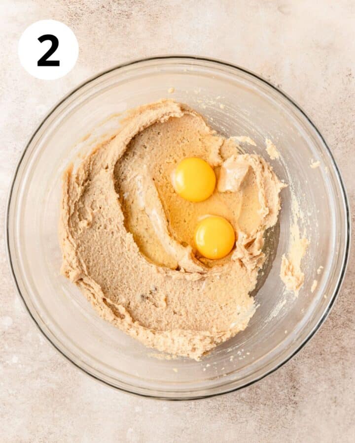 adding eggs to dough.