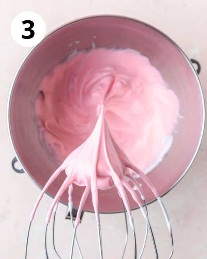 adding pink food coloring and whipping egg whites to stiff peaks.