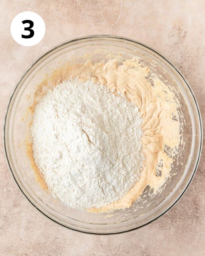 adding dry ingredients to biscotti dough.