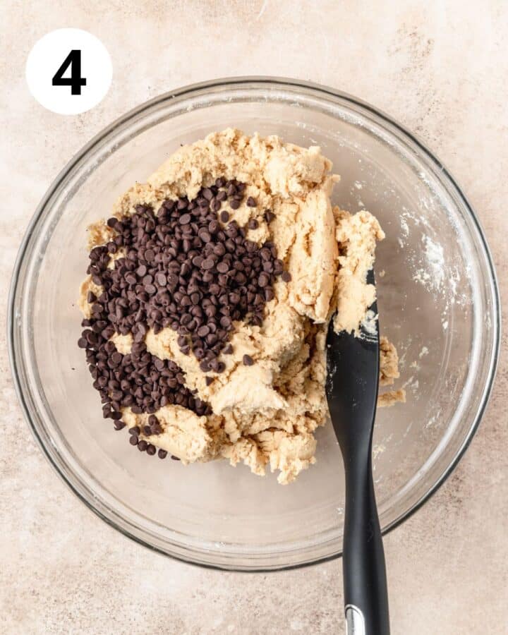 adding mini chocolate chips to dough.