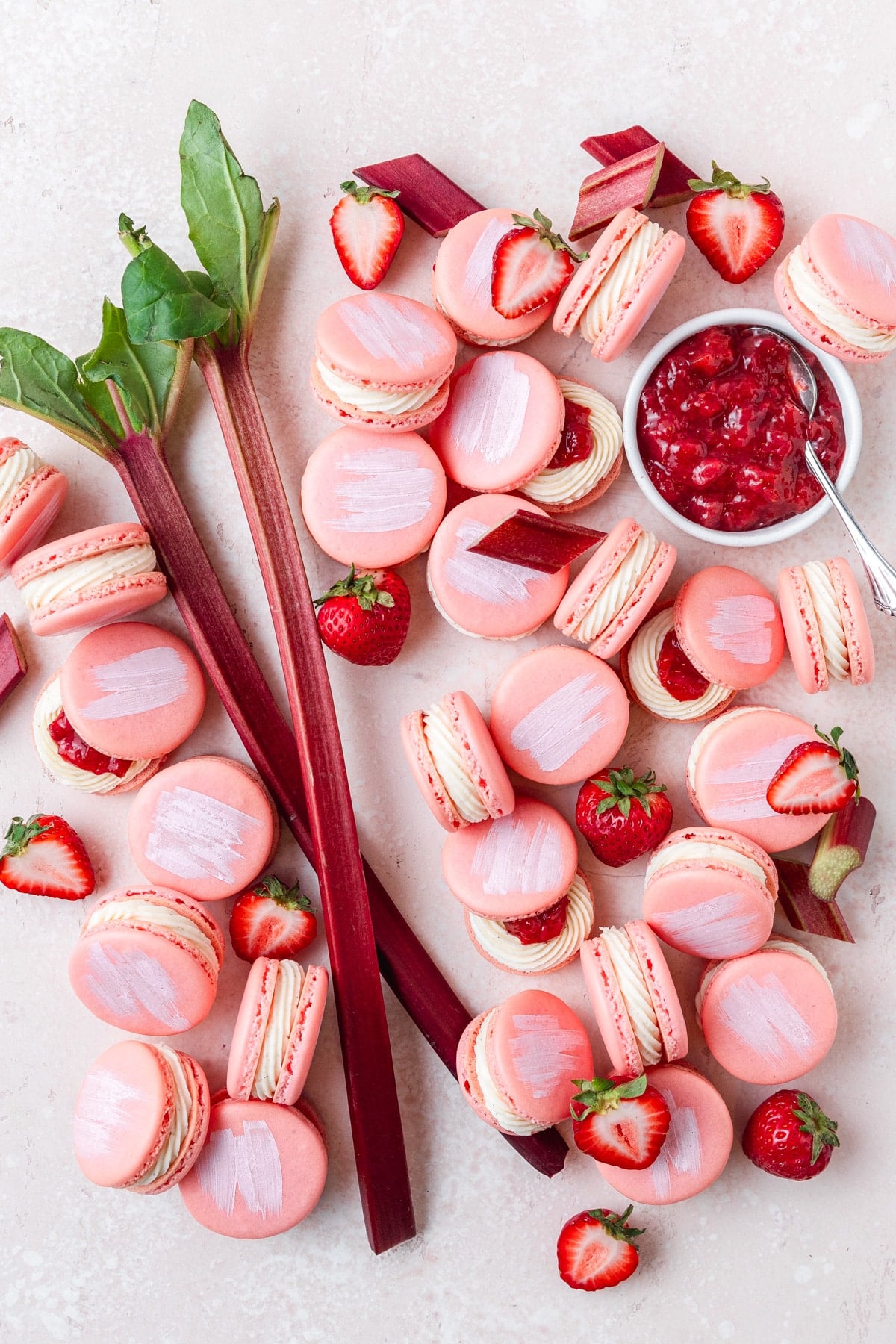 strawberry rhubarb macarons with vanilla bean buttercream.