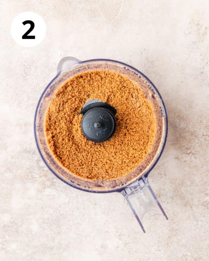 gingersnap cookie crumbs in food processor.
