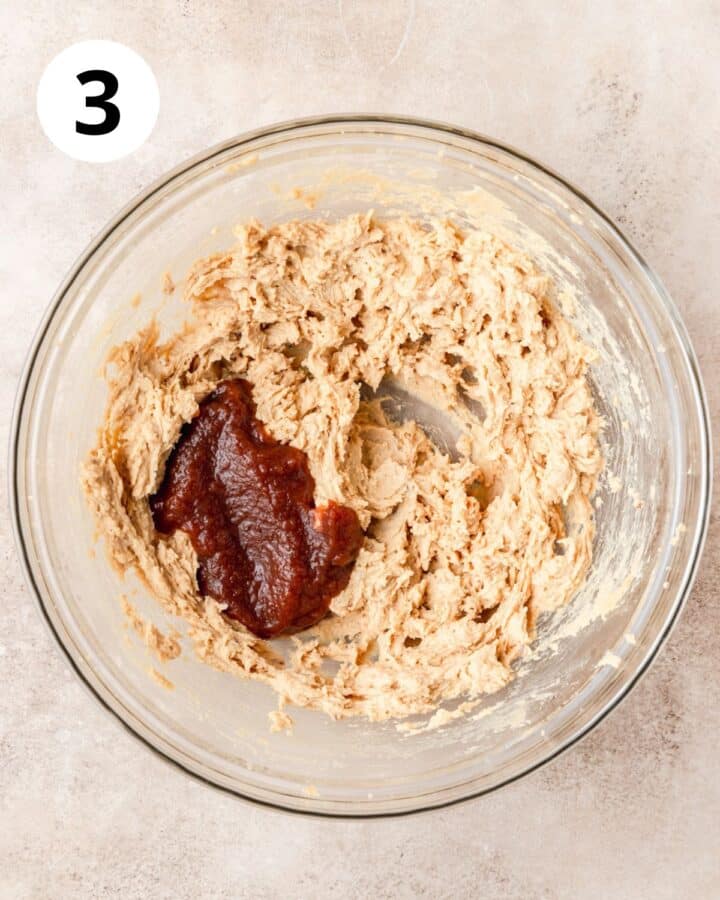 adding apple butter to cookie dough.