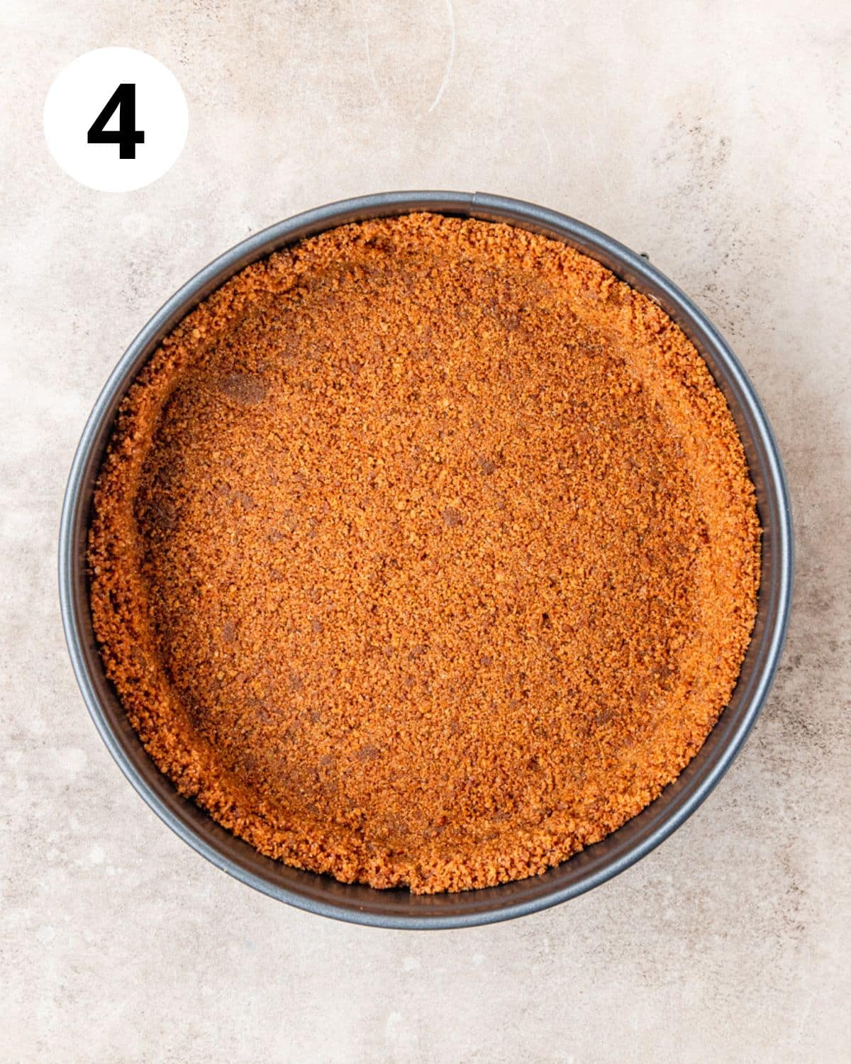 gingersnap cookie crust pressed into springform pan.