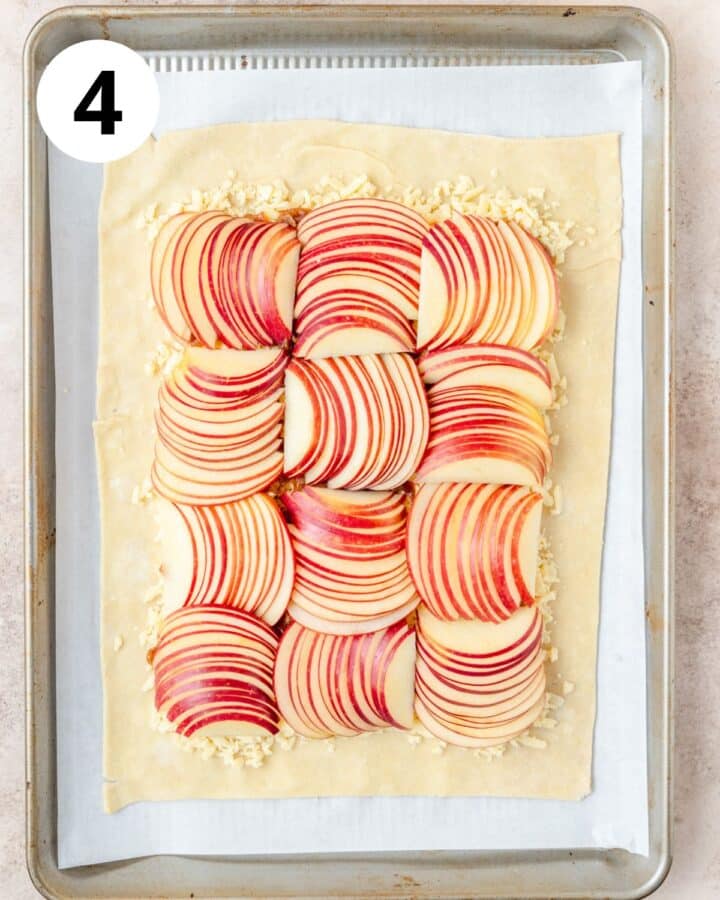 arranging sliced apples on top of cheese.