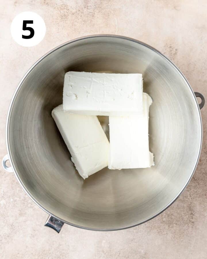 blocks of cream cheese in stand mixer.