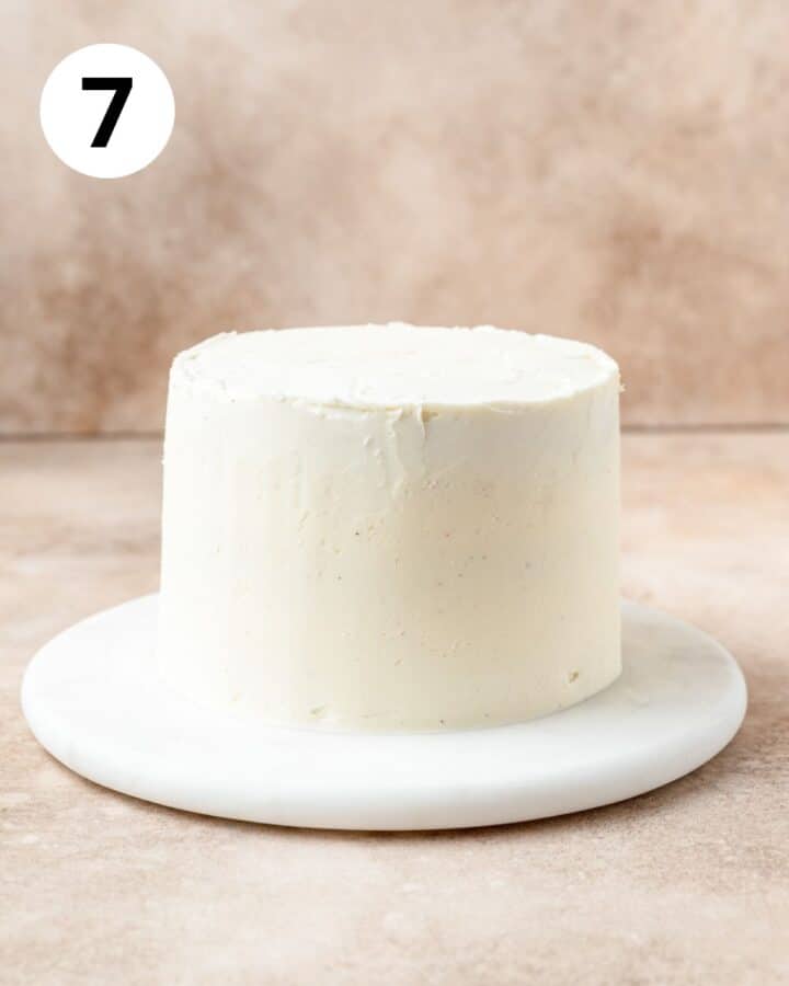 eggnog cake layers with frosting spread on outside.