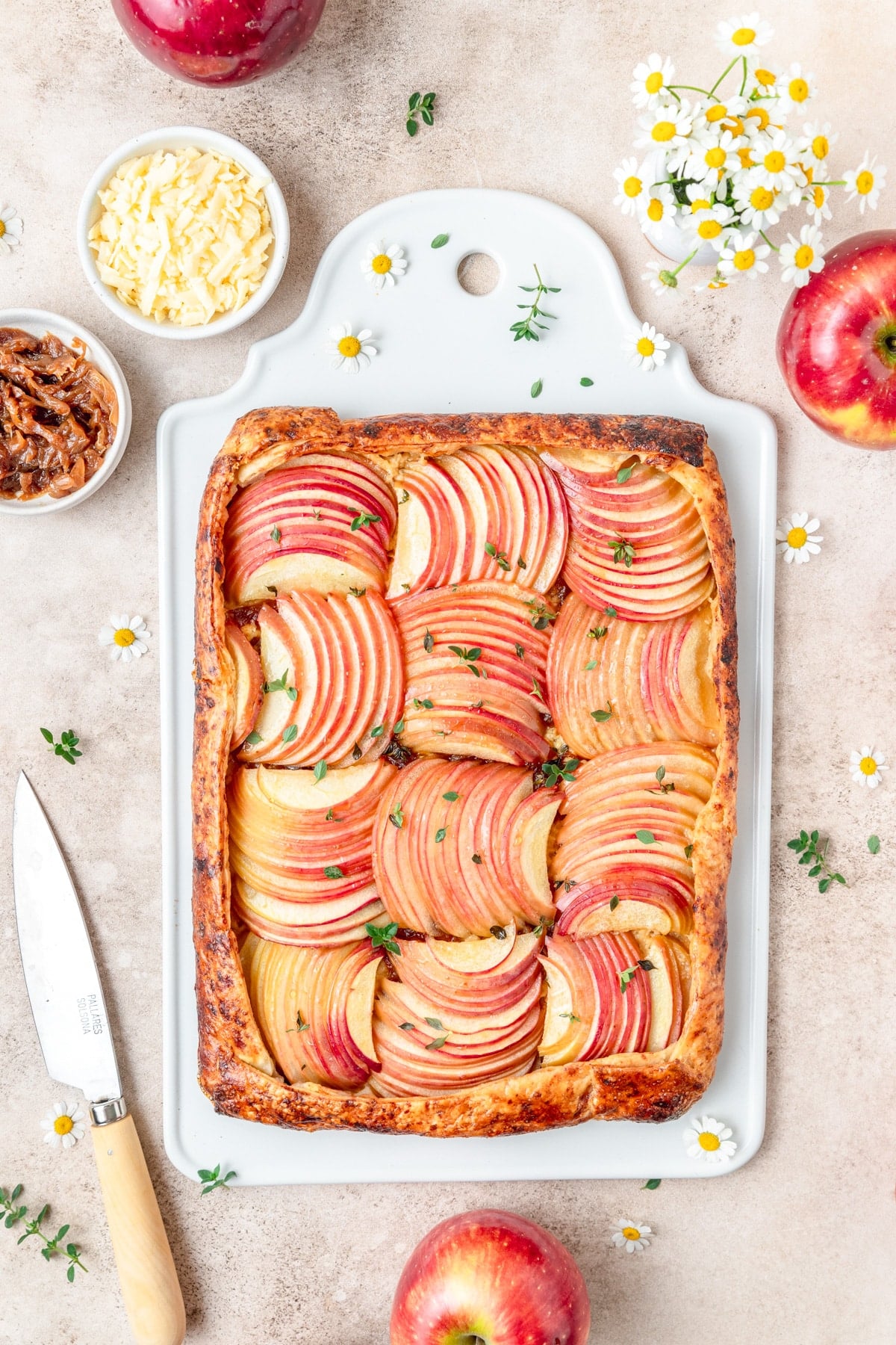 sliced apple and cheddar galette with caramelized onions.
