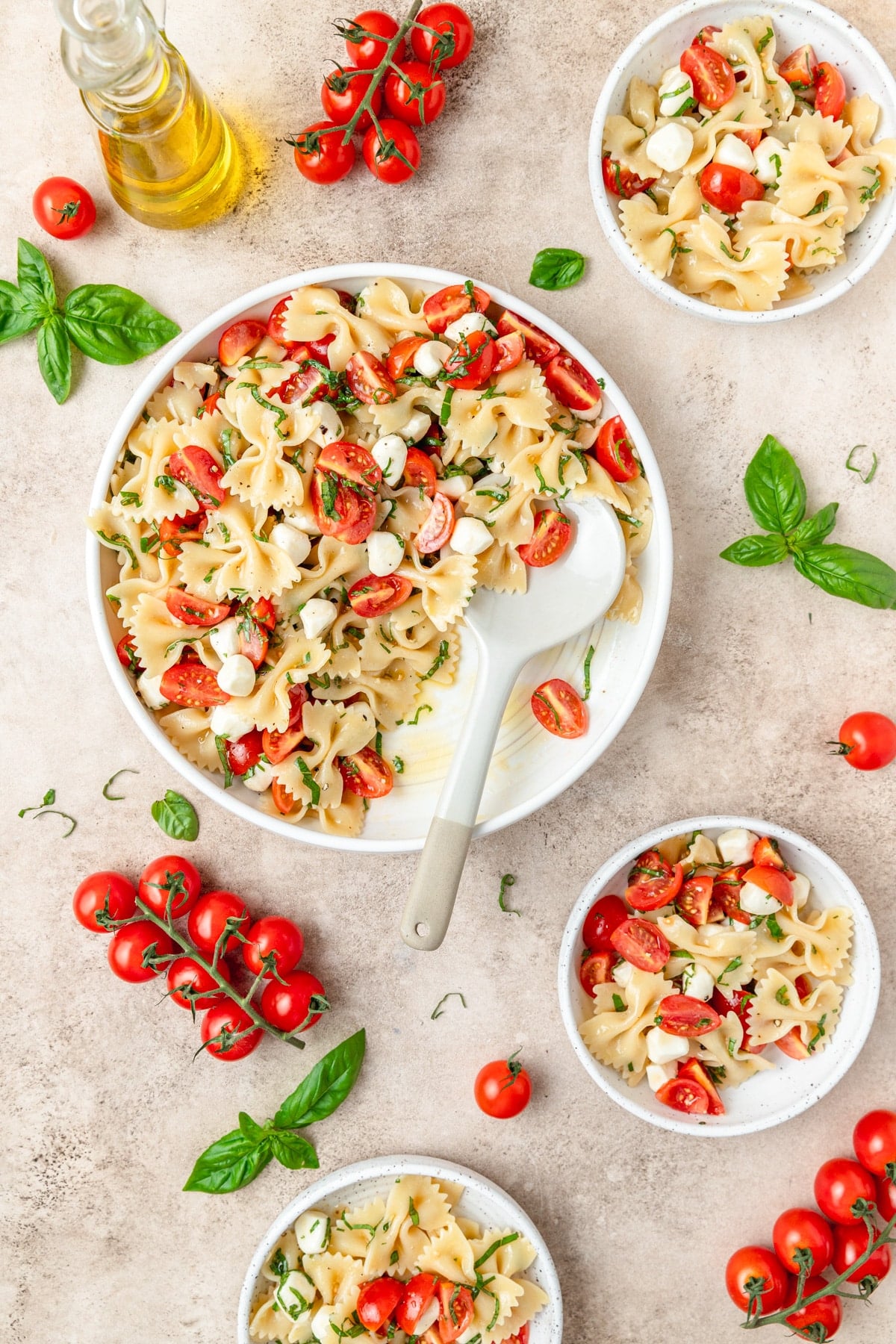 caprese pasta salad with mozzarella pears and cherry tomatoes. 