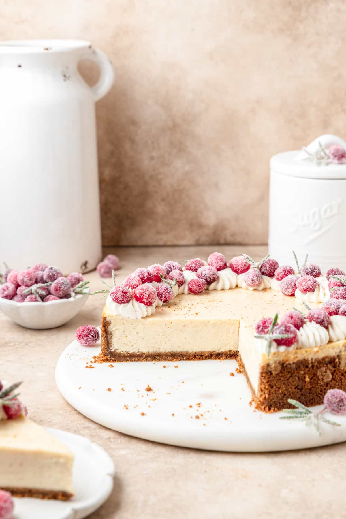 eggnog cheesecake topped with sugared cranberries.