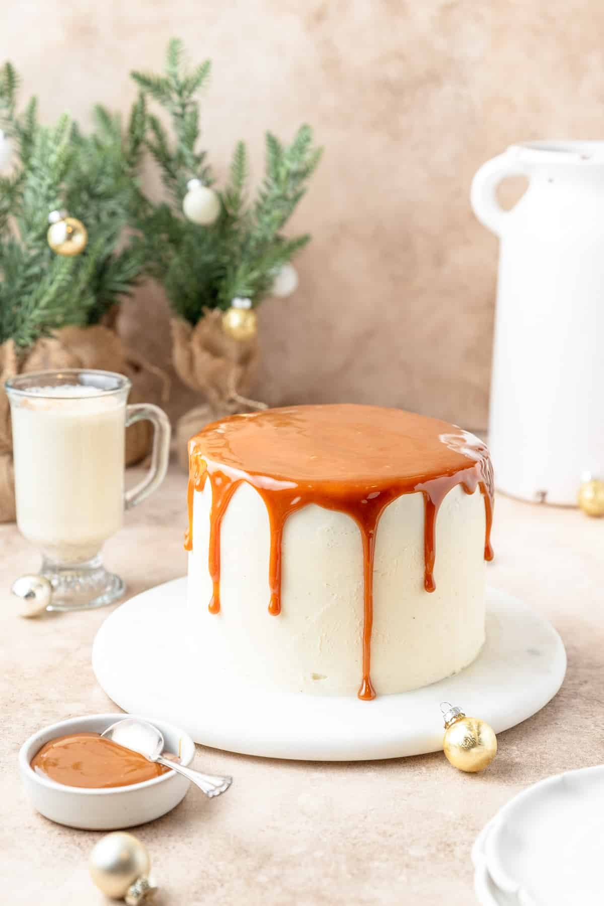 topping eggnog cake with caramel sauce.