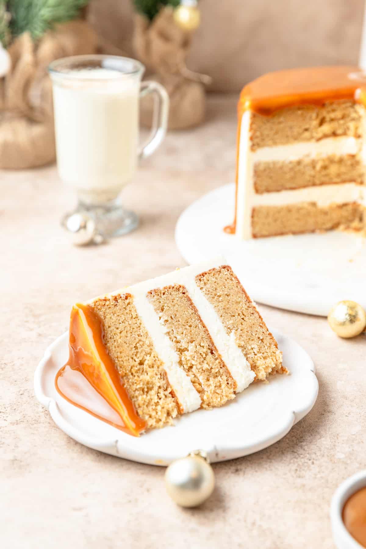 slice of eggnog layer cake on plate.