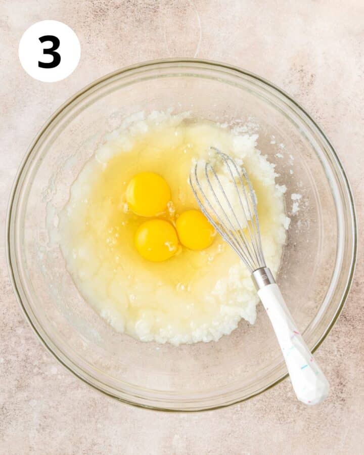 adding eggs to batter.