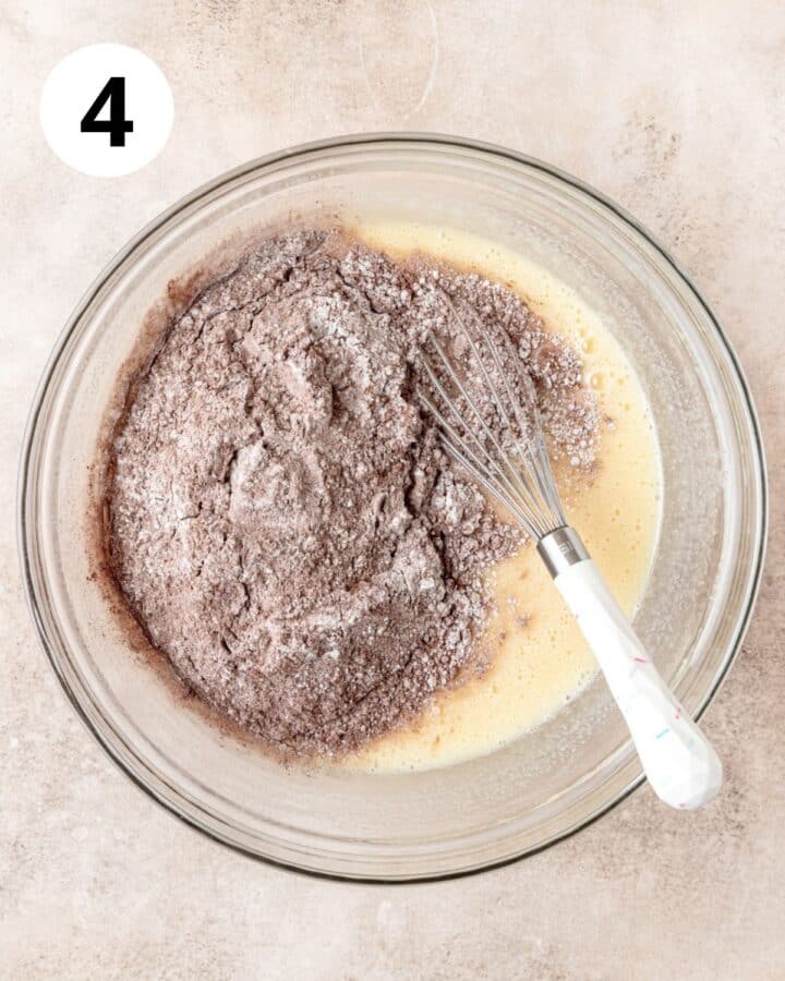 adding dry ingredients to batter.