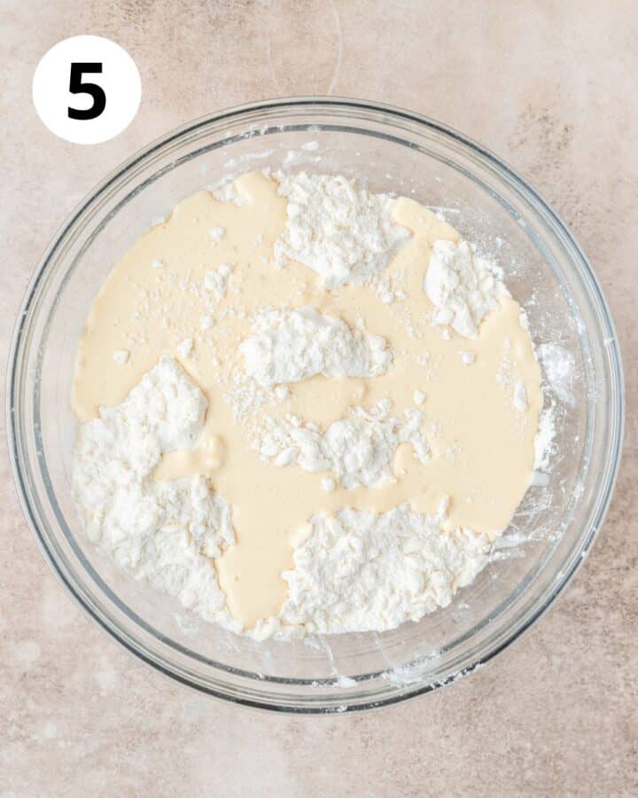 adding eggnog to scone dough.