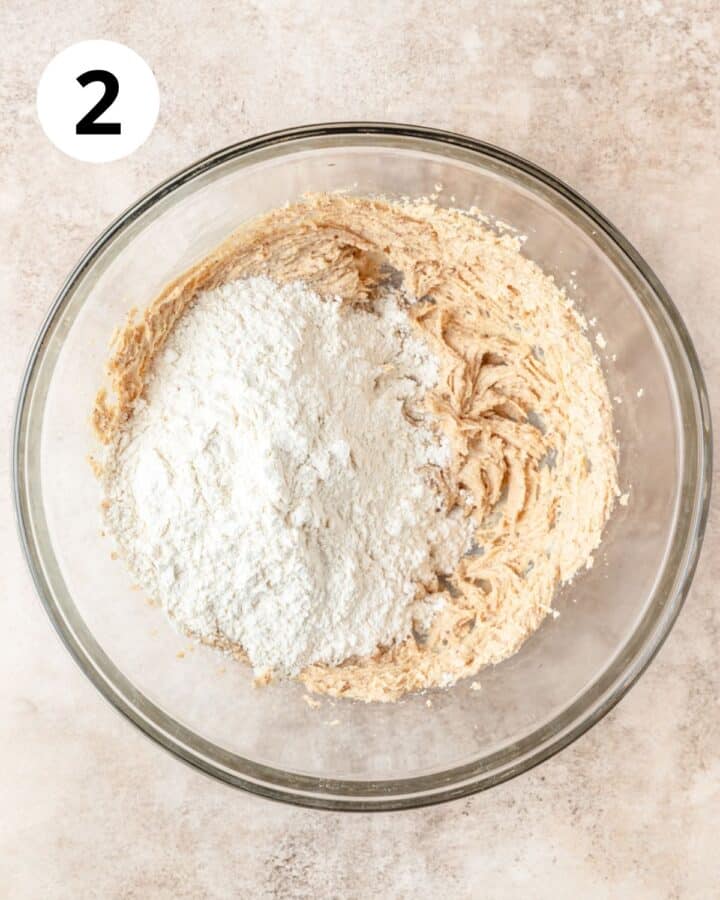 adding flour to dough.