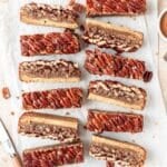 pecan pie cookie bars with brown butter shortbread crust.