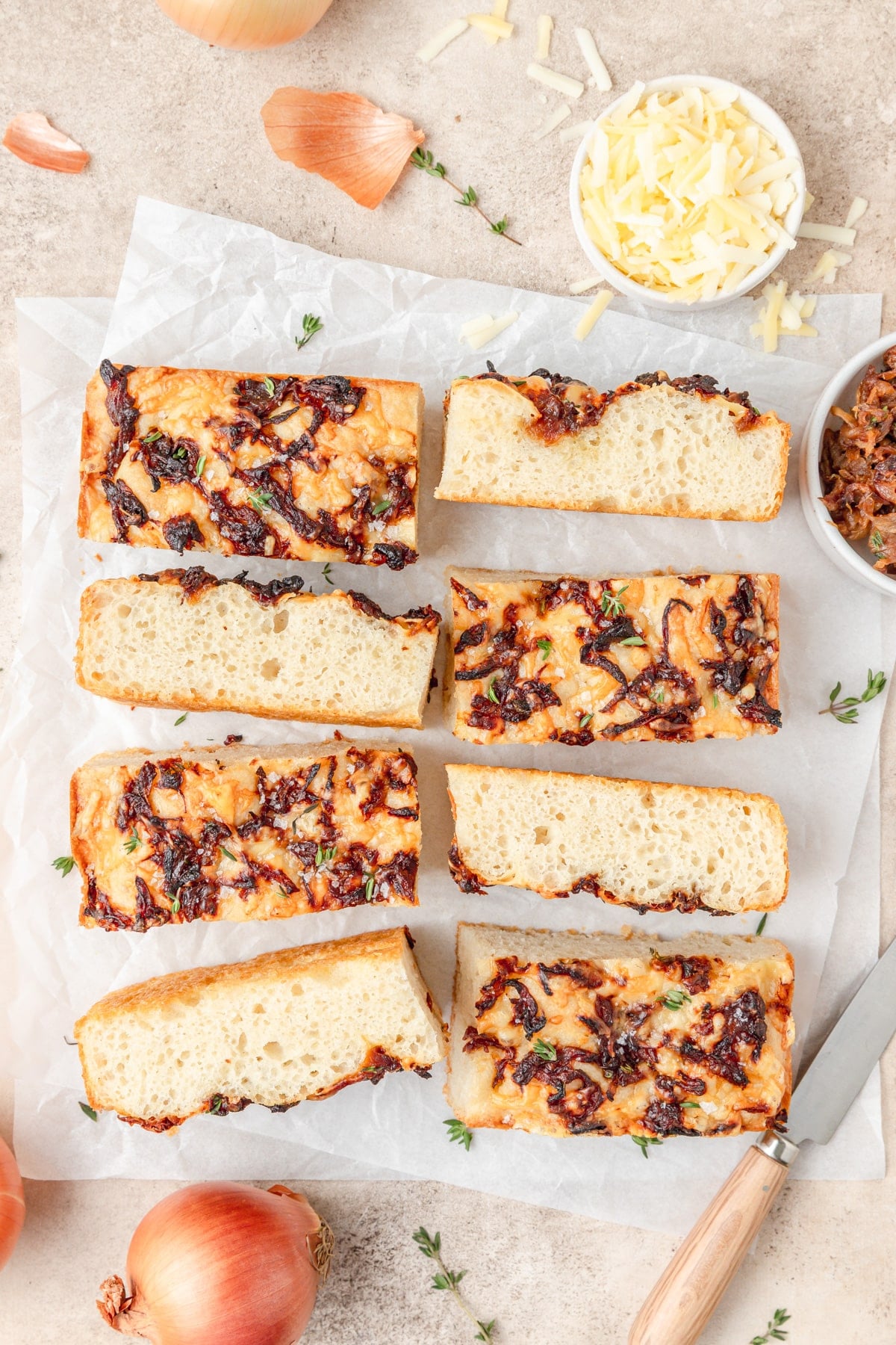 French onion focaccia cut into slices.