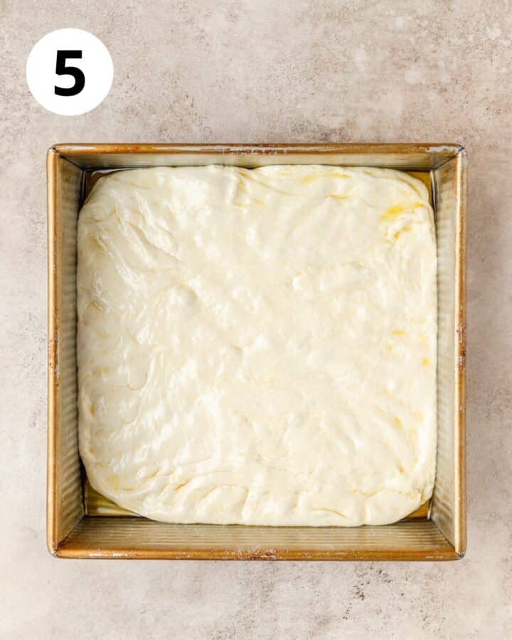 focaccia dough in square pan.