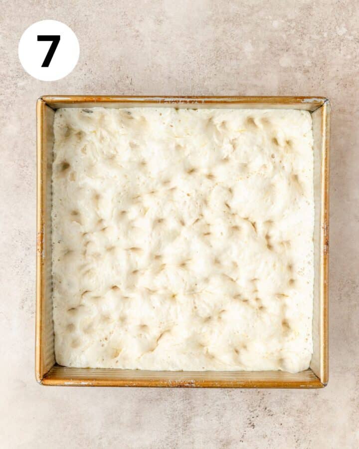 dimpling focaccia dough.