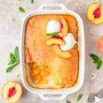 cornbread peach cobbler topped with ice cream.
