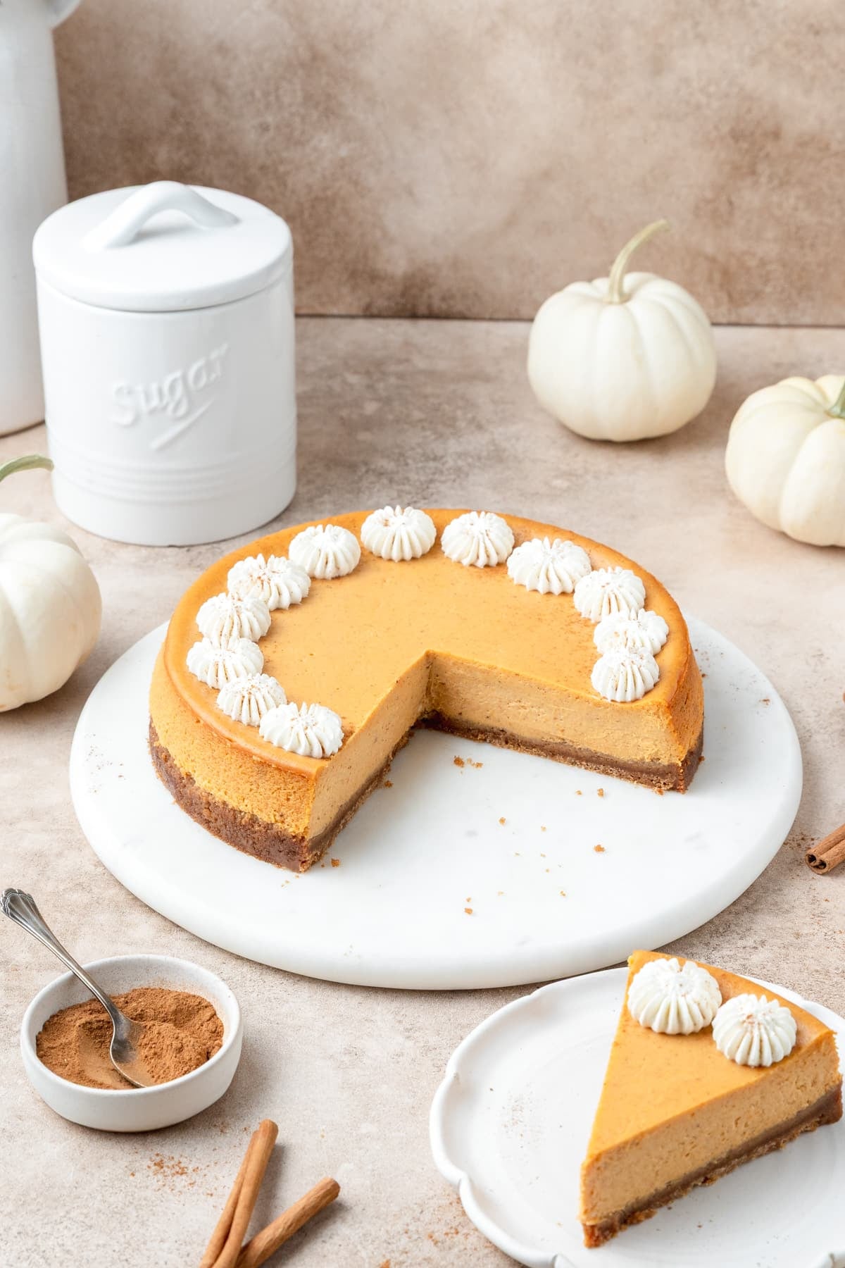 pumpkin cheesecake with slice cut out.